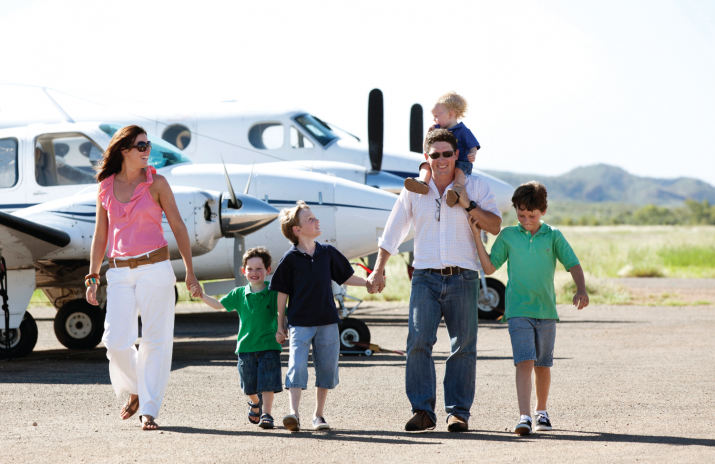 Photo - DHA investors near an airfield. Andrew is a part time pilot with a dream of owning his own flying school