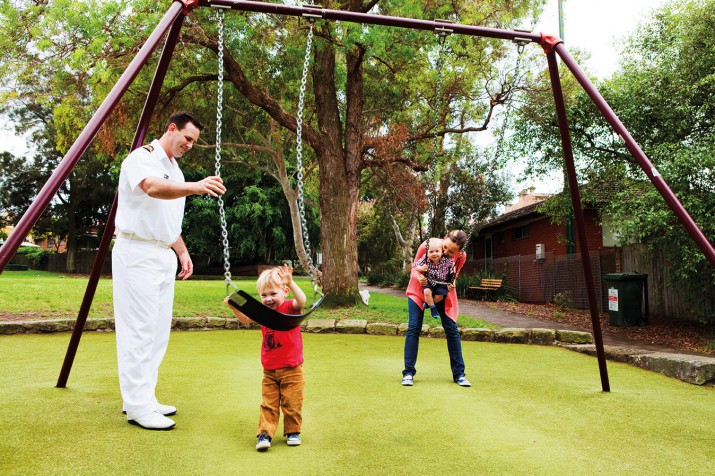 A modern Defence family outside their DHA home