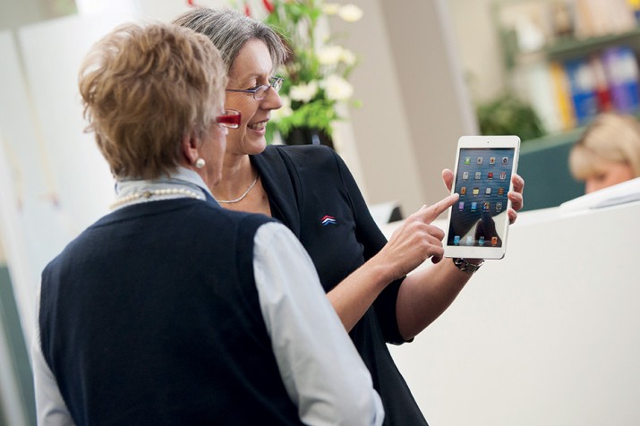 DHA staff using an iPad