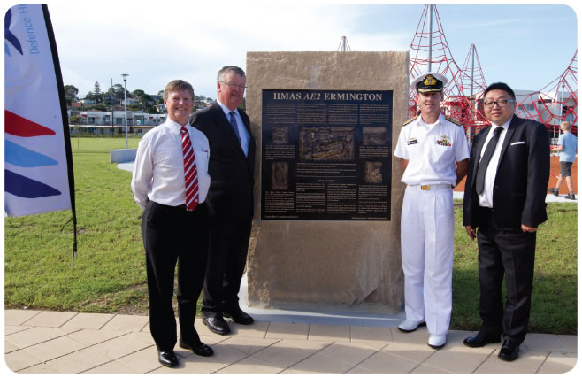 Image of DHA Managing Director, Peter Howman with naval dignitaries, Commodore Roach and Commodore Scott, and John Hugh, Councillor of Parramatta City Council, unveiling a commemorative plaque at our AE2 development in Ermington, Sydney, NSW.