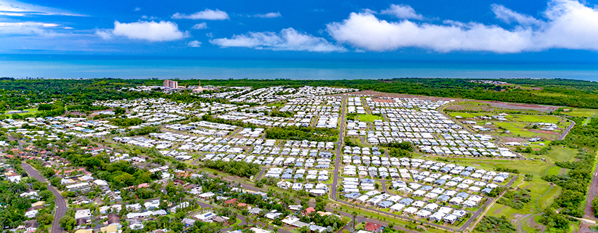 Aerial view of Breezes Muirhead showing housing and ocean in the background.