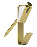 An image of a gold picture hook with a nail through it ready for hanging