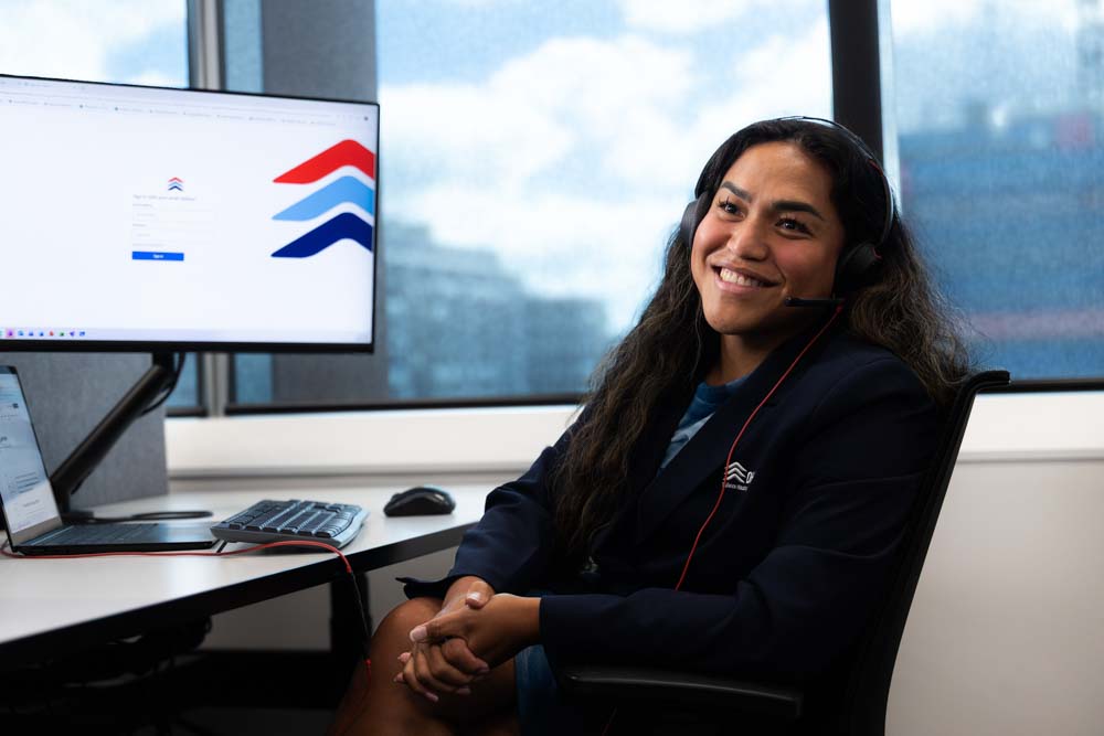 Woman sitting at desk smiling