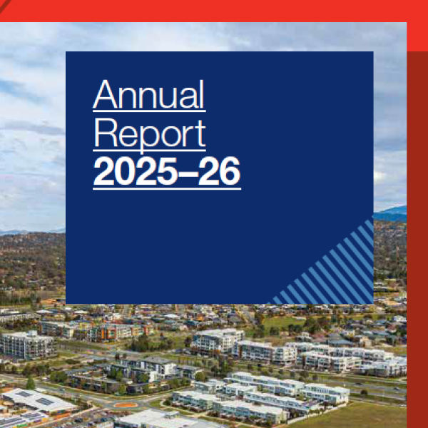 Aerial shot of a development on the front cover of the DHA Annual Report 2025-26