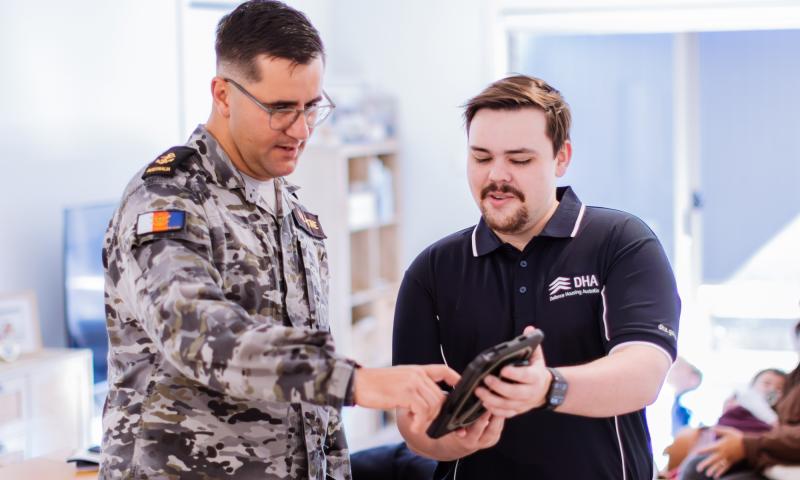 A Navy Defence member interacts with a DHA Property Manager.